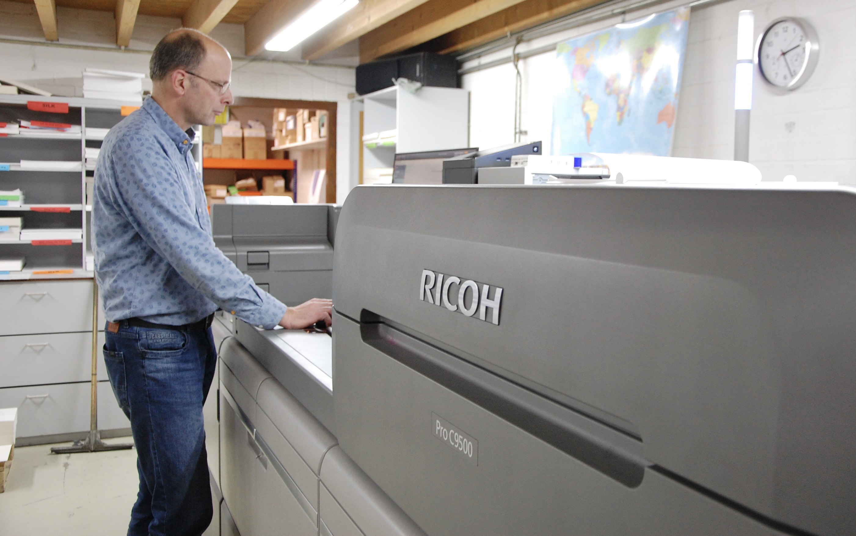 Person working with a Ricoh printer