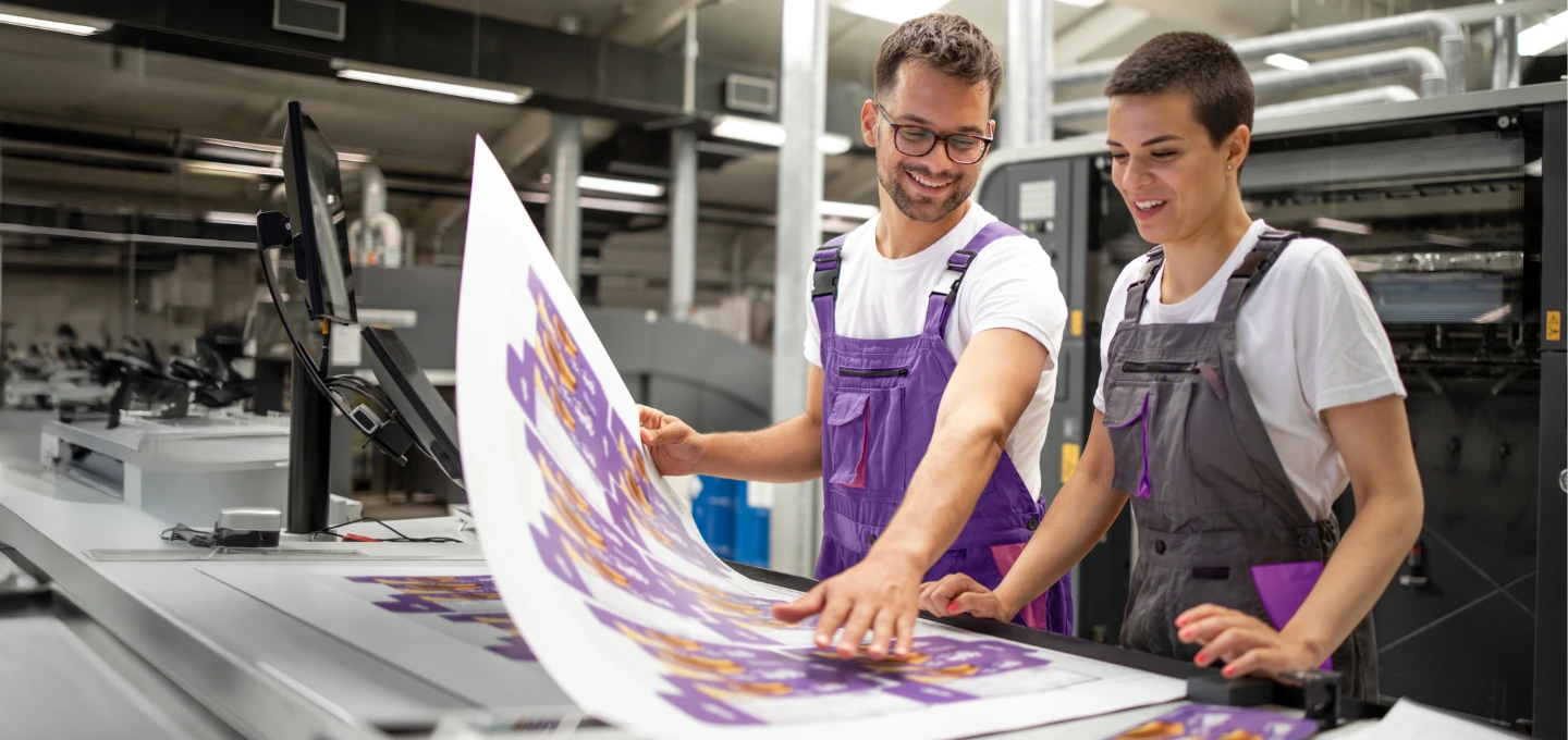 Graphic Printing - People looking at large print outs